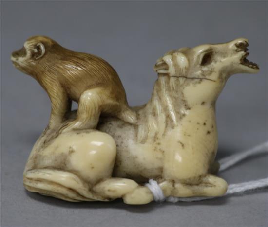A 19th century ivory netsuke of a horse and monkey
